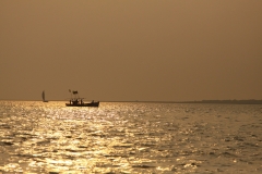 Fishing boat and Sailboat heading home
